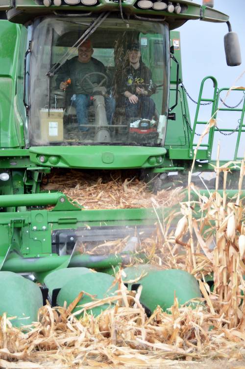2024 Corn Harvest Student and producer in combine