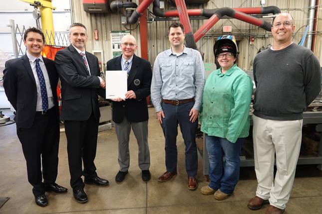 Enbridge advisor for community engagement Taylor Smith, left, and area manager Dave Bareham were joined by IVCC President Jerry Corcoran, Dean of Workforce Development Shane Lange, welding lab instructor Theresa Molln and State Rep. Lance Yednock