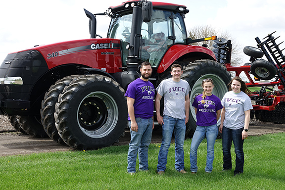Ag students in front of tractor