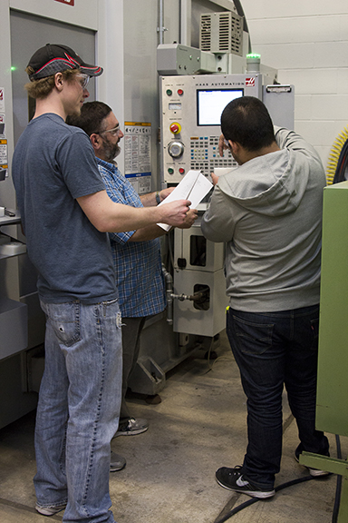 Students and instructor at CNC Machine